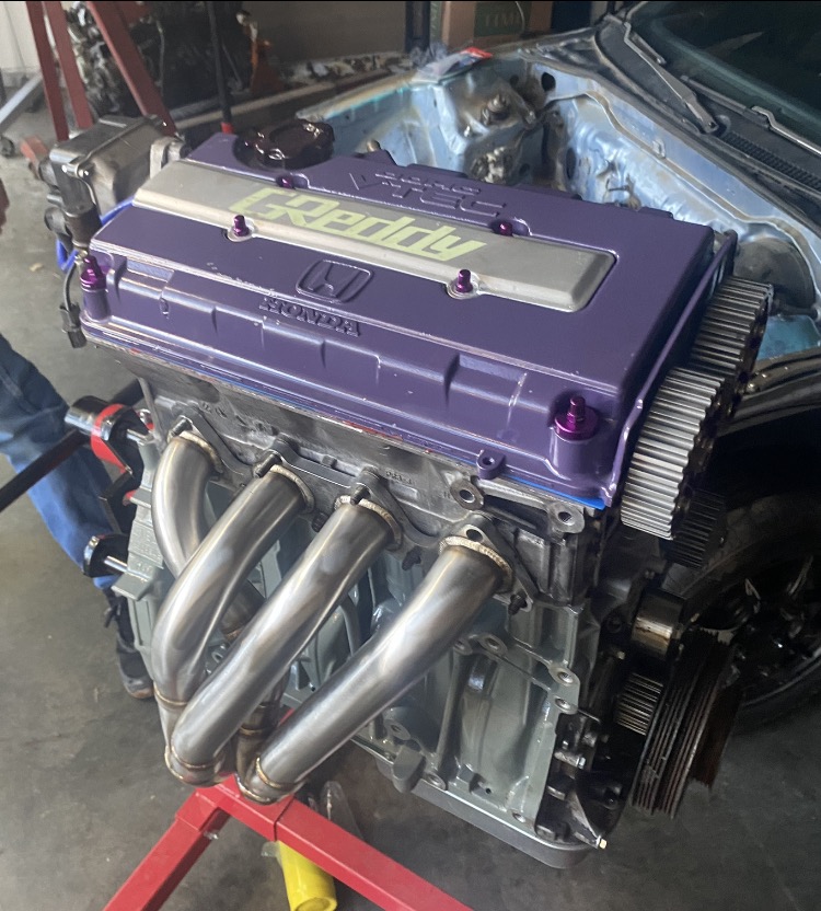 A fully built Honda engine on a stand