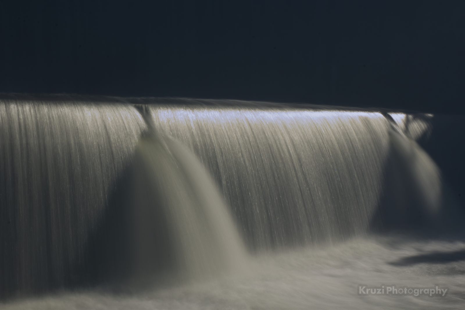 Water flowing over the dam